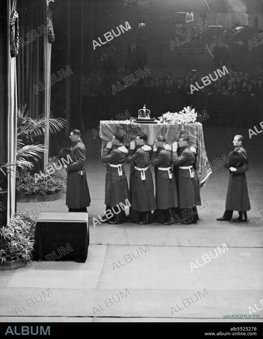 Borne by a bearer party from the King's Company, Grenadier Guards the coffin of King George VI is taken from the train at Kings Cross where it was placed on the King's Troop gun-carriage. February 11, 1952. (Photo by Daily Mirror).