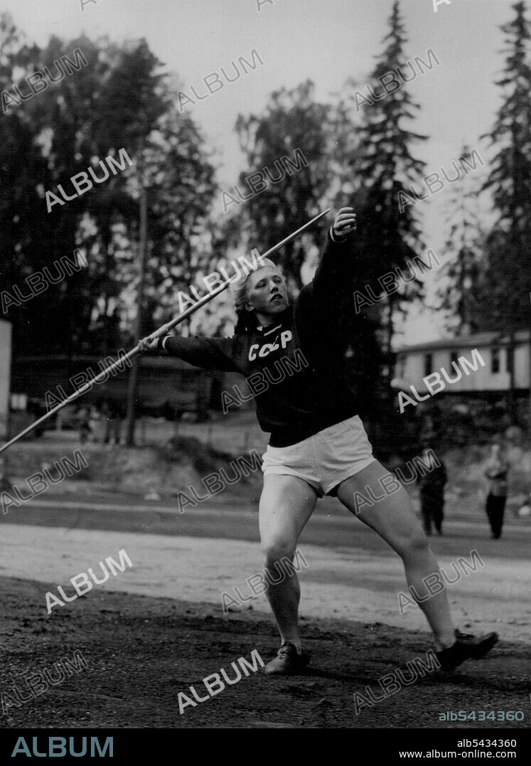Throwing For Russia - Blonde-haired Galina Shabina, the Russian girl javelin-thrower, seen during practice at the Otanismi Camp, near Helsinki, where the 'Iron Curtain' athletes are housed for the Olympics. July 17, 1952.