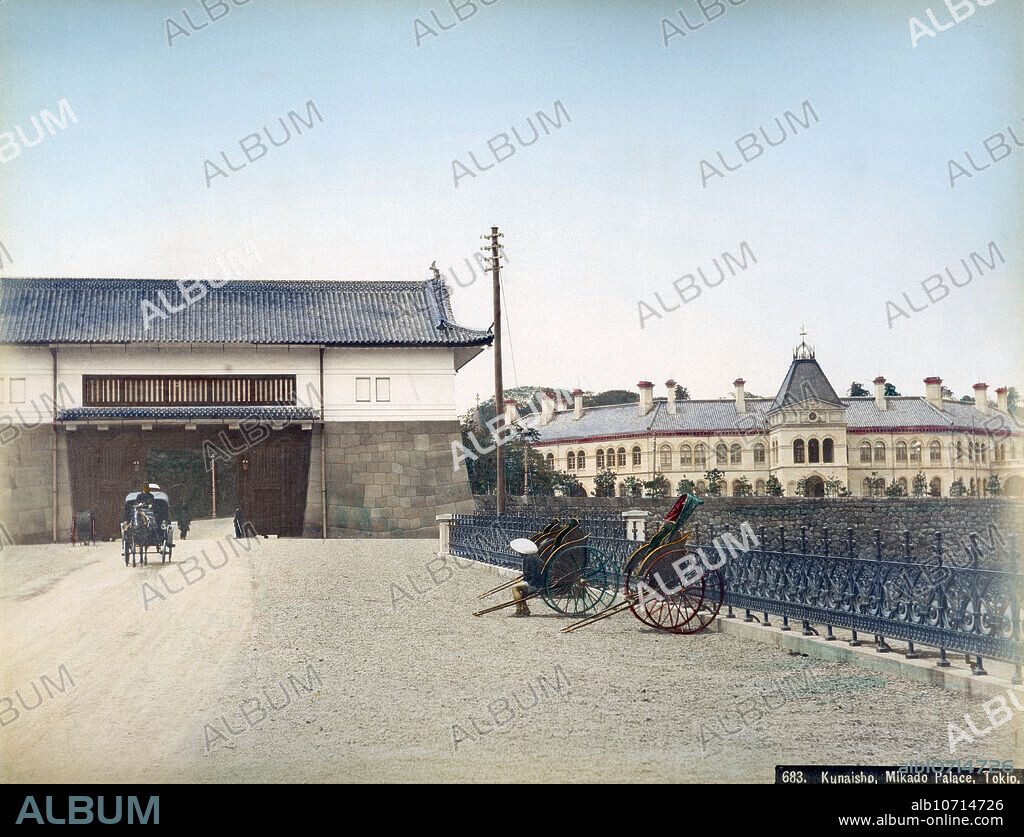 [ 1890s Japan - Sakashita-mon Gate and Imperial Household Building at the Imperial Palace in Tokyo ] A horse-drawn carriage has just passed through the Sakashita-mon Gate of the Imperial Palace in Tokyo, while three jinrikisha (rickshaws) are waiting for passengers. In the back the Kunaisho (Imperial Household) building can be seen. The Sakashita-mon was part of the original Edo Castle. 19th century vintage albumen photograph.