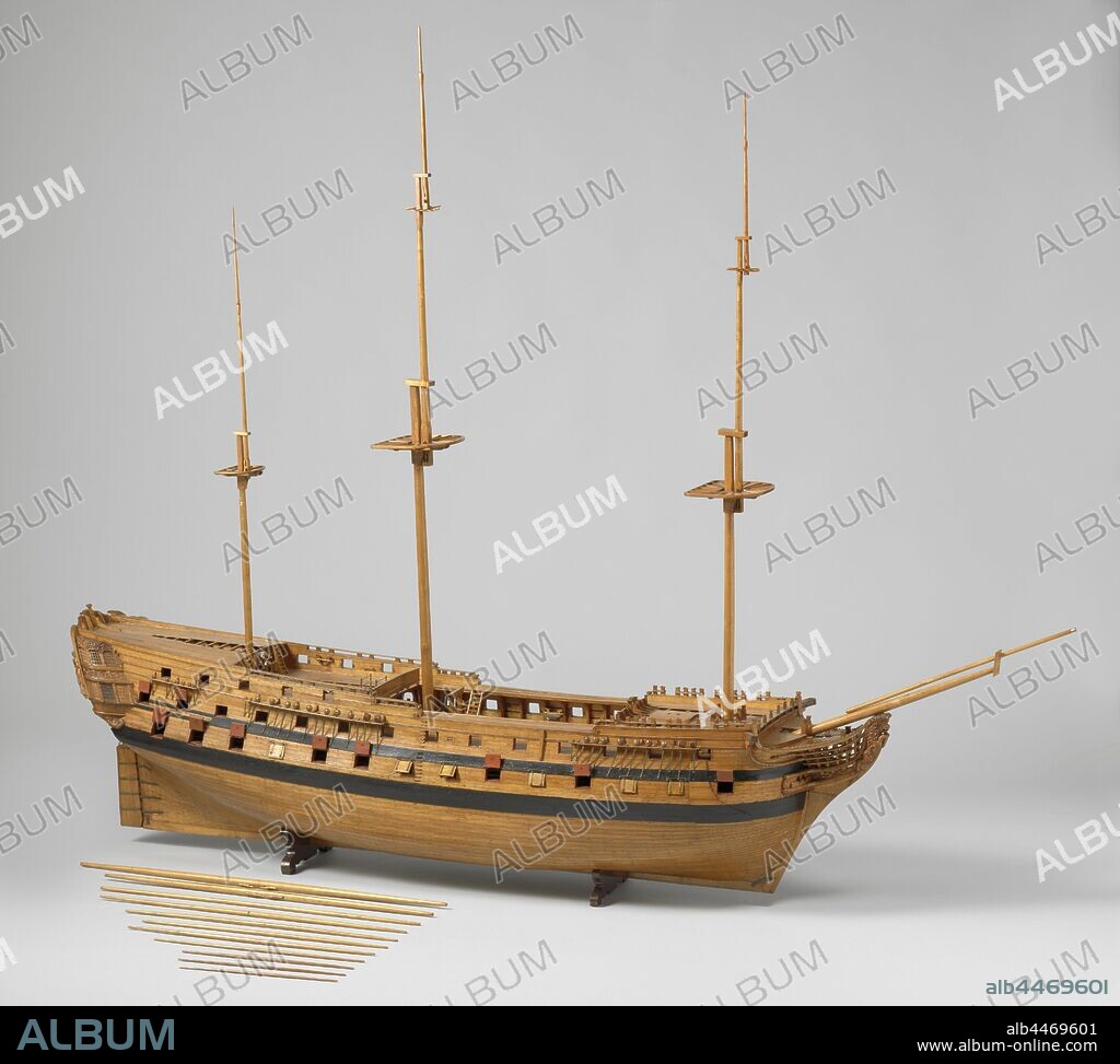 Model of a 74-Gun Ship of the Line, Detailed detailed construction model of the hull in two stacked halves, with loose round timber. Seventy-four gun ports spread over three decks, five decks in total, with full bombardment and many equipment, some parts numbered. On the elaborate galleon a crowned lion as figurehead, four conveniences, a sea horse and fish between the slobles. Twisted mirror and hollow wulf with two gates, fence and side gallery of two floors, entirely decorated with carvings of allegorical figures, praises and weapon trophies. Straight rudder equipped with suckers, with square rudder king and holes for two rudder pins, steering wheel on the half deck in front of the bezaansmast. The sheer rises to both ends, two barwood and two deer. Round underwater ship. All rests with damsel blocks are arranged. 1:33 scale (derived), Battle of Camperdown, Rotterdam, Admiralty on the Maze, Freedom (ship), anonymous, Amsterdam (possibly), c. 1782, wood (plant material), brass (alloy), paint (coating), h 51.5 cm × l 180 cm × w 40.5 cm.