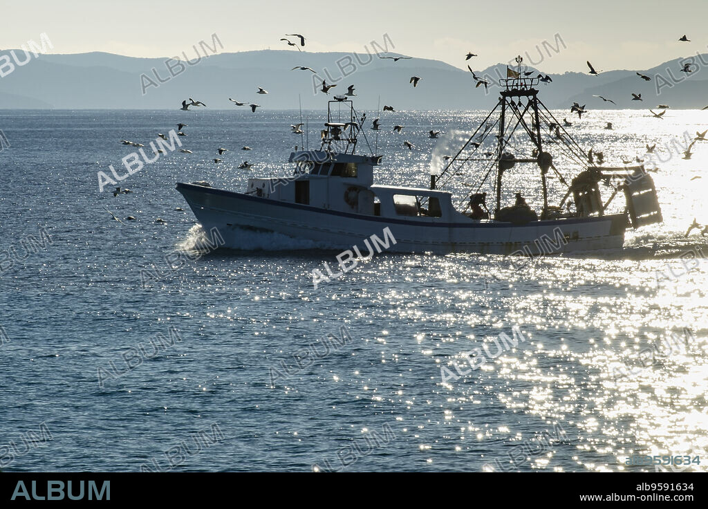Fishing boat in front of Cabrera National Park,Santanyi, Mallorca, balearic islands, spain, europe.