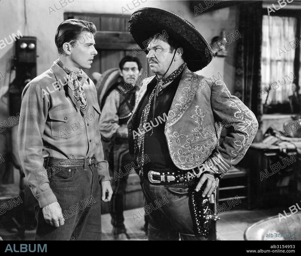 Hollywood, California:  1941 Actor Ronald Reagan defies bad guy Wallace Beery in a dramatic scene in the film, 'The Bad Men'.