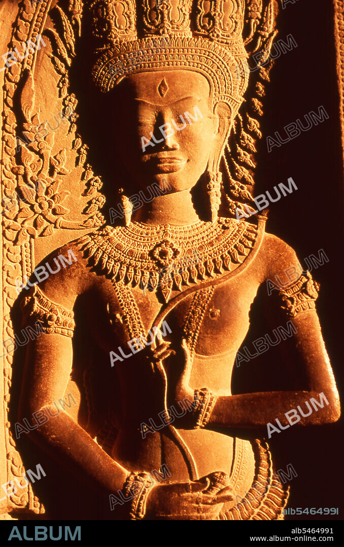 Angkor Wat was built for King Suryavarman II (ruled 1113-50) in the early 12th century as his state temple and capital city. As the best-preserved temple at the Angkor site, it is the only one to have remained a significant religious centre since its foundation - first Hindu, dedicated to the god Vishnu, then Buddhist. It is the world's largest religious building. The temple is at the top of the high classical style of Khmer architecture. It has become a symbol of Cambodia, appearing on its national flag, and it is the country's prime attraction for visitors. Angkor Wat combines two basic plans of Khmer temple architecture: the temple mountain and the later galleried temple, based on early South Indian Hindu architecture. It is designed to represent Mount Meru, home of the devas in Hindu mythology: within a moat and an outer wall 3.6 kilometres (2.2 mi) long are three rectangular galleries, each raised above the next. At the centre of the temple stands a quincunx of towers.