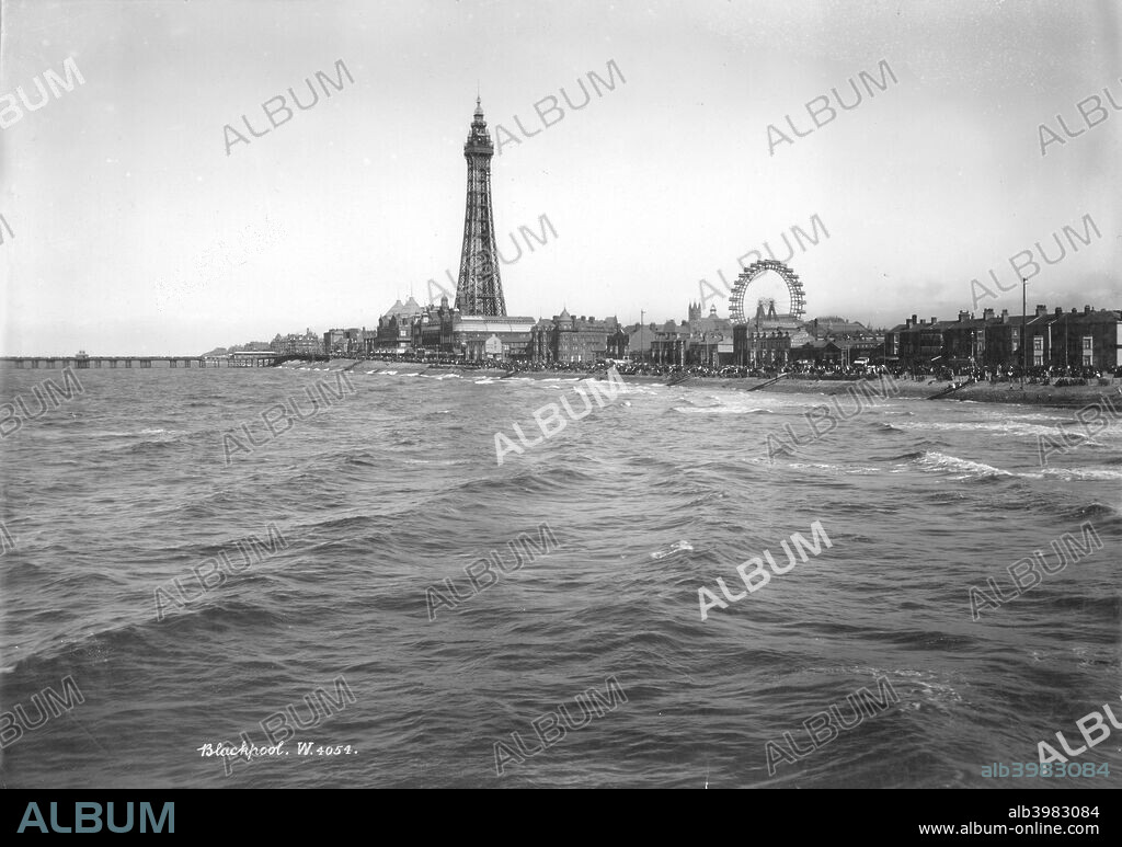 High tide at Blackpool, Lancashire, 1894-1910. A view from the Central Pier across the sea towards Blackpool Tower with the Big Wheel in the distance. The tower was built in 1891-1894 by Maxwell and Tuke and dominates the town.