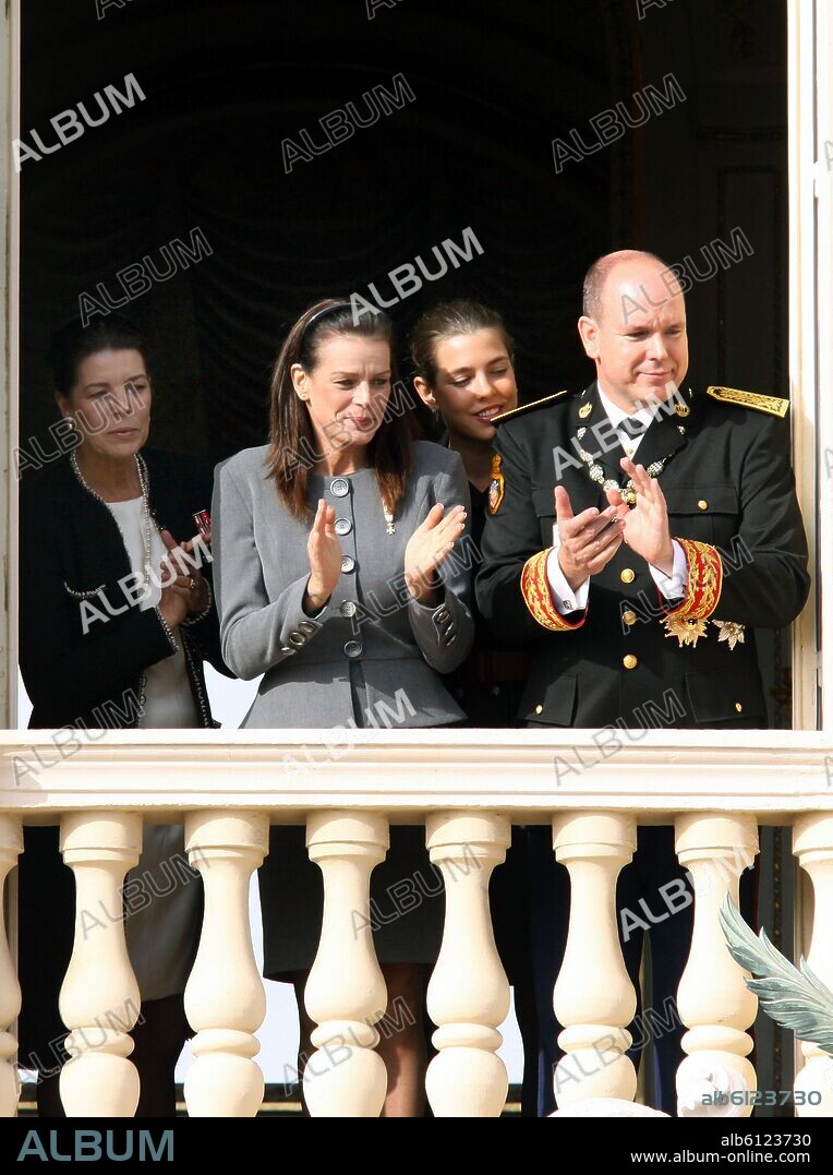 L-R) Princess Caroline of Hanover, Princess Stephanie of Monaco, Charlotte  Casiraghi and Prince Albert II of Monaco smile on a balcony during the Army  Parade as part of M - Album alb6123730