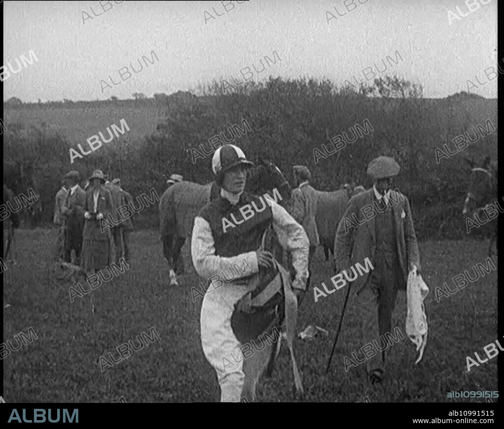 A Female Civilian Wearing a Jockey's Outfit Walking on a Horse Racing Track Watched by a Small Crowd, 1920s. From "Time to Remember - Teenage Flapper", 1920s (Reel 3); a dcumentary about women's lives in the 1920s - great commentary by Joyce Grenfell.