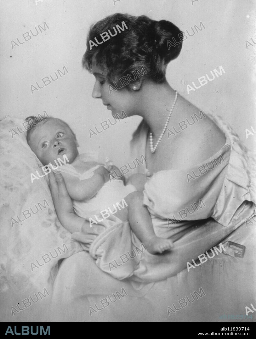 Baby boy of title exhibited at women ' s welfare centre . Baroness Ella Pollak von Parnegg with her little son , the Baron Alexander , who was shown as a good specimen of ' the hundread per cent baby '. 13 August 1926.
