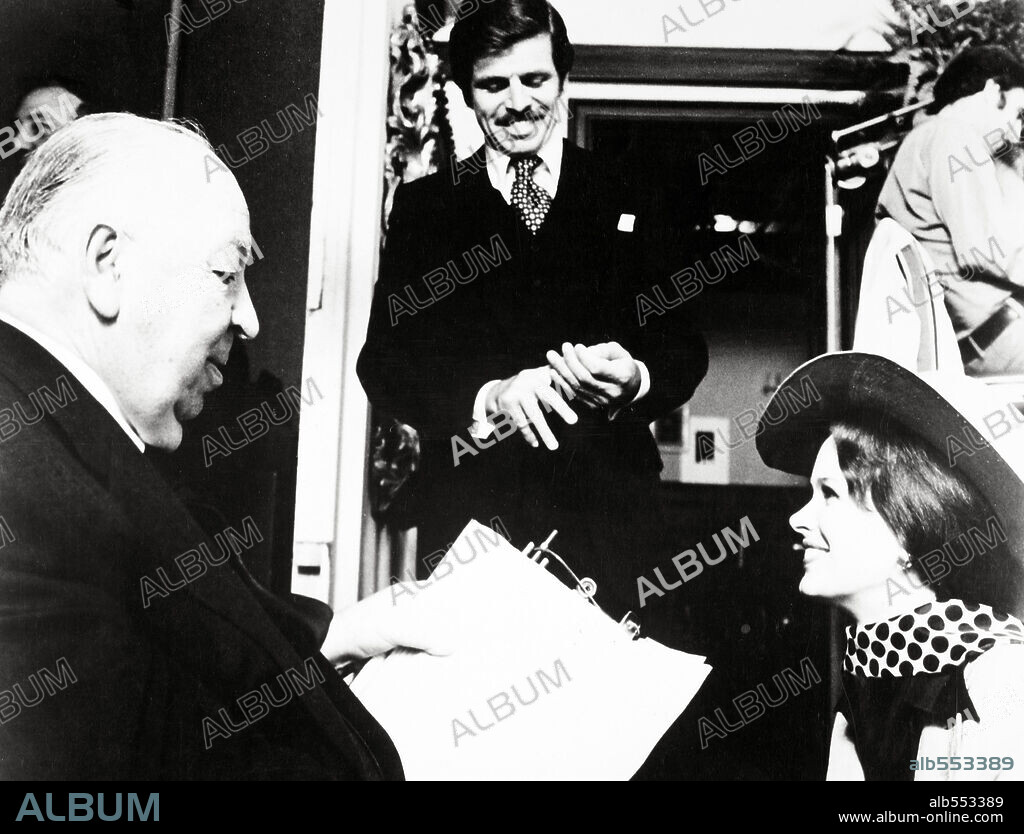 ALFRED HITCHCOCK, KAREN BLACK and WILLIAM DEVANE in FAMILY PLOT, 1976, directed by ALFRED HITCHCOCK. Copyright UNIVERSAL PICTURES.