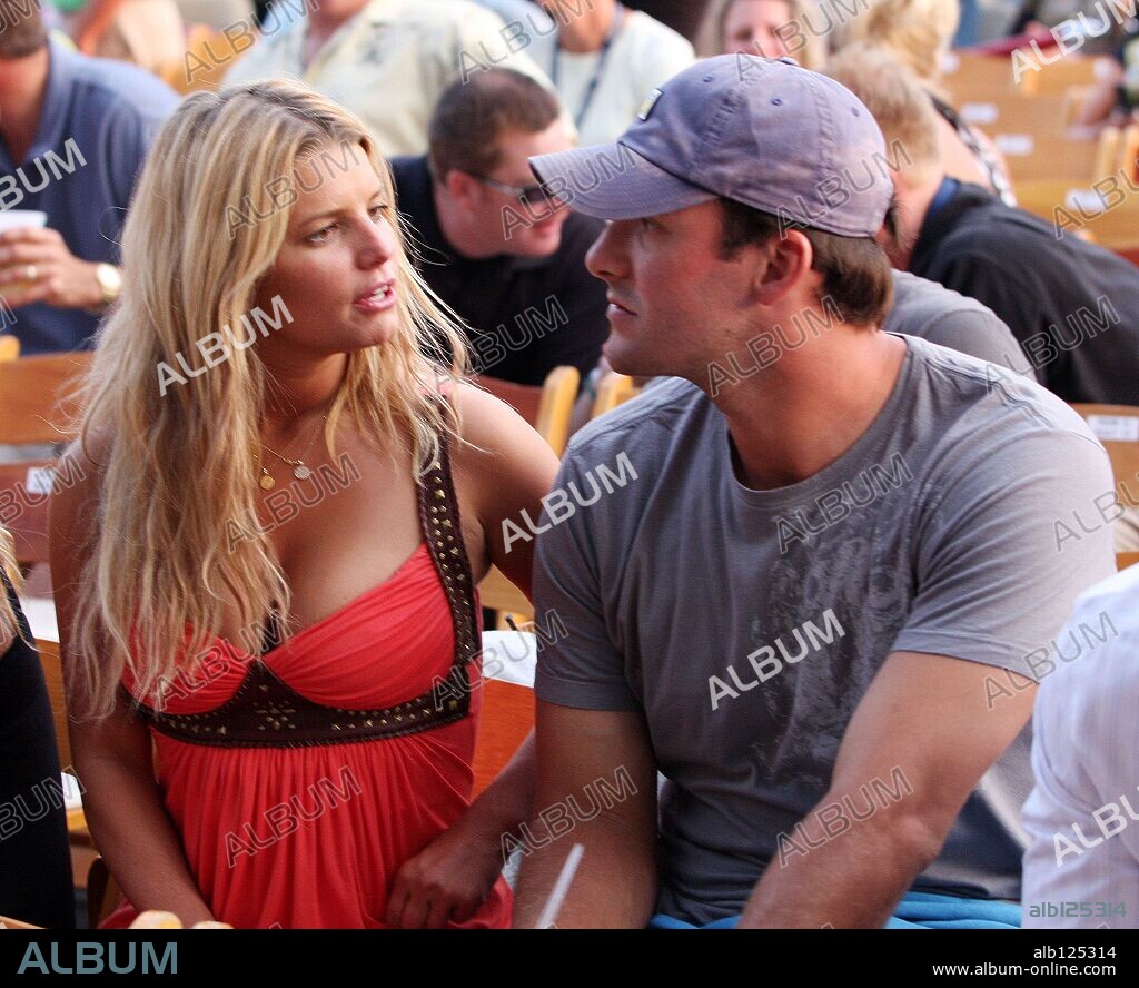 Jul 12, 2008 - Stateline, Nevada, USA - Actress, JESSICA SIMPSON and her Bo, Dallas Cowboys All-Pro Quarterback, TONY ROMO in deap conversation before a Heart concert. The couple was walked out early from the next band, Journey. Tony Romo had a 10:30 tee off the next day for the ''American Century Championship'' golf. The concert took place at Harvey's casino parking lot. 12/07/2008