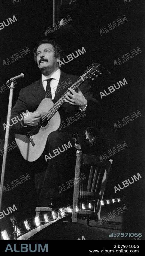 MAURICE ZALEWSKI. Georges Brassens (1921-1981), French singer-songwriter and poet. During a concert at Bobino in Paris (France). In 1957.