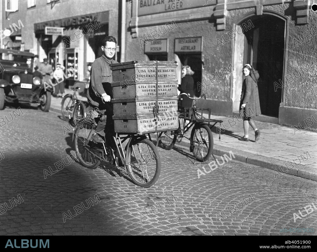Delivery boy with bread boxes from the Lisa Öhman Bakery, Stockholm, Sweden, 10th October 1942.