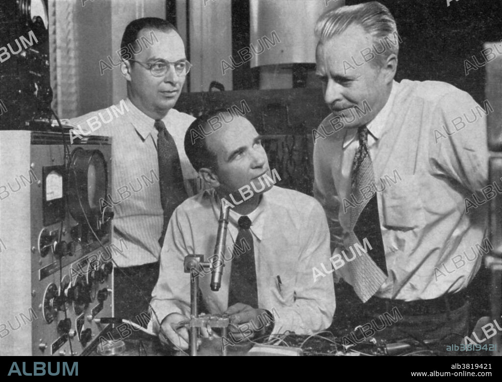 John Bardeen (1908-1991), William Shockley (1910-1989), and Walter H. Brattain (1902-1987) (left to right) shown at Bell telephone laboratories in 1948 with an apparatus used in the early investigations which led to the invention of the transistor. These men won the Nobel Prize in Physics in 1956 for the invention of the transistor.