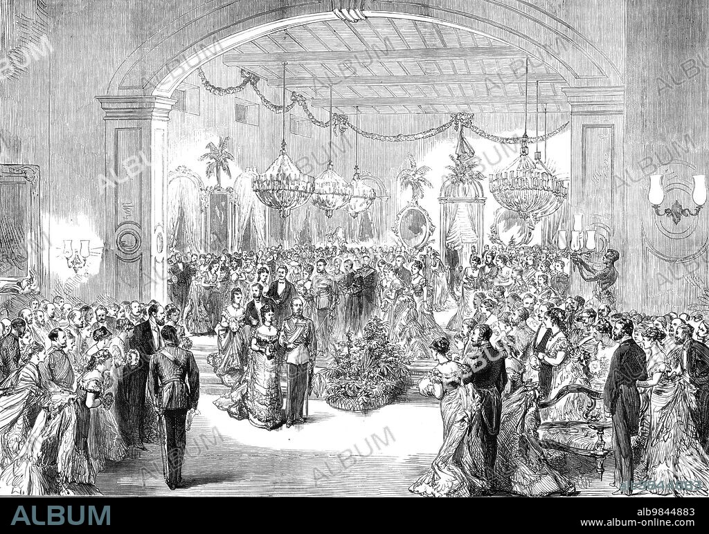 The Royal Visit to India: the Madras Club Ball, from a sketch by an officer of the Serapis, 1876. The future King Edward VII '...attended a ball given in his honour...The Prince [of Wales] wore full-dress Field Marshal's uniform... There were no native Princes...Nothing could exceed the taste or the brilliancy of the decorations, the ball-room itself being adorned with palm-trees placed between each of the arches opening into the colonnade...About 600 guests were present...The Prince...opened the ball with Mrs. Shaw Steward, the wife of Colonel Steward, the president of the club...his Royal Highness and Mrs. Steward had for their vis a vis an Austrian Prince and Lady Mary Grenville...[the] dancing went on most gaily, and it was nearly four o'clock [am] before the Prince left. He danced many times, and appeared to enjoy himself most thoroughly'. From "Illustrated London News", 1876.