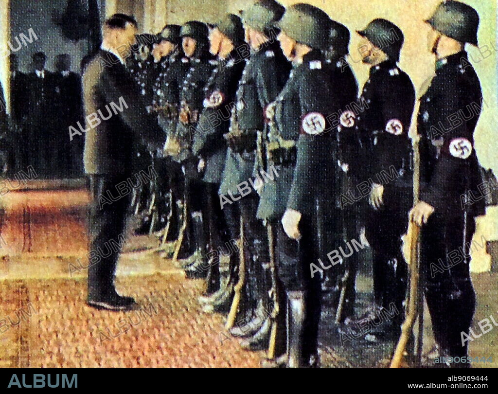 Hitler greet ssome of his guards at the Chancellor's Office in Berlin 1935.