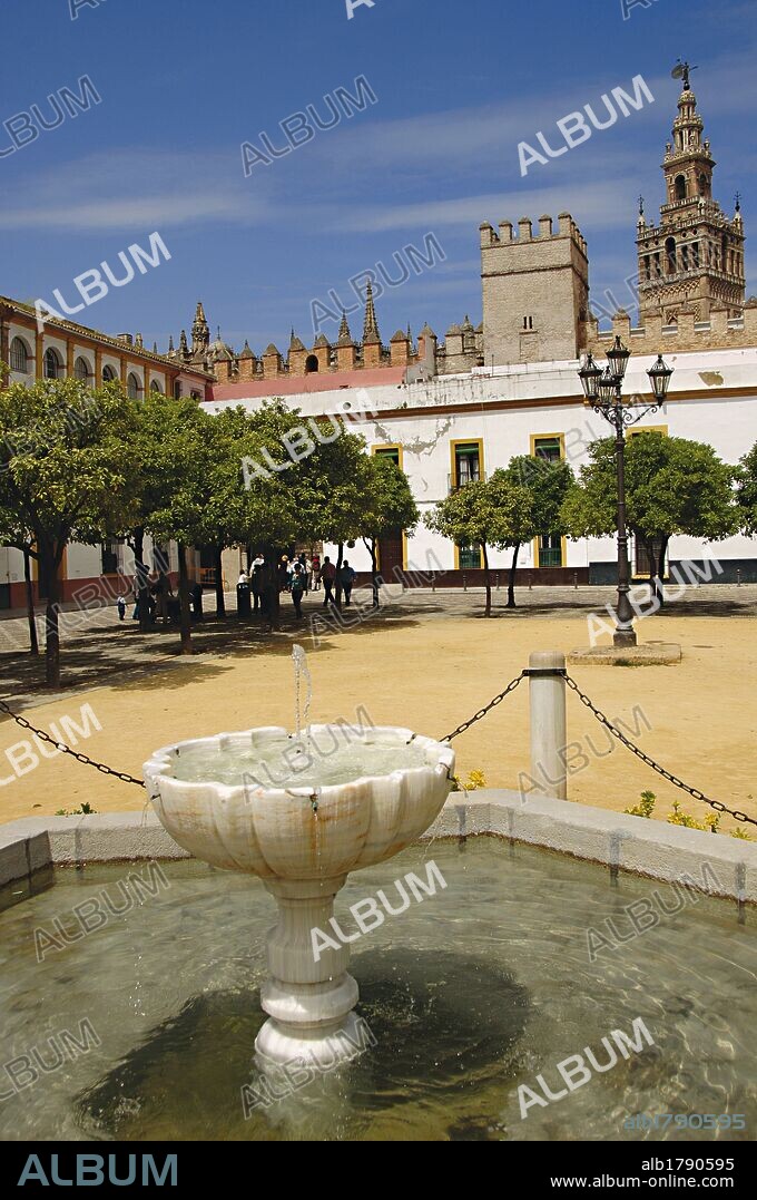 Spain. Andalusia. Seville.  Royal Alcazars of Seville (Real Alcazar). Courtyard of flags. Its present appearance is due to remodeling because of the Latin American Exhibition of 1929. The source, hexagonal, was built in 1928 by Jose Diaz Lafita.