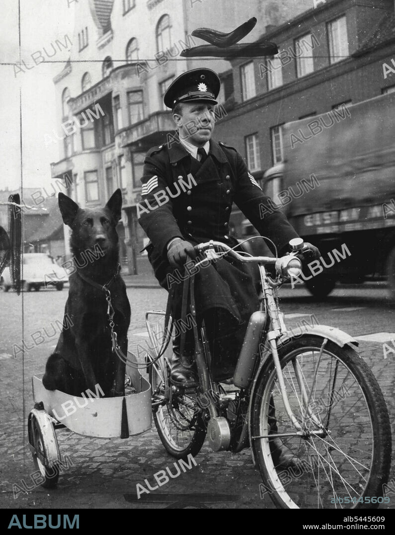 Policeman Johann Mueller, of Hamburg, Germany, with his trained police dog, Astor, which travels in his sidecar. Mueller and his dog perform patrol work. April 04, 1955. (Photo by Planet News Ltd.).