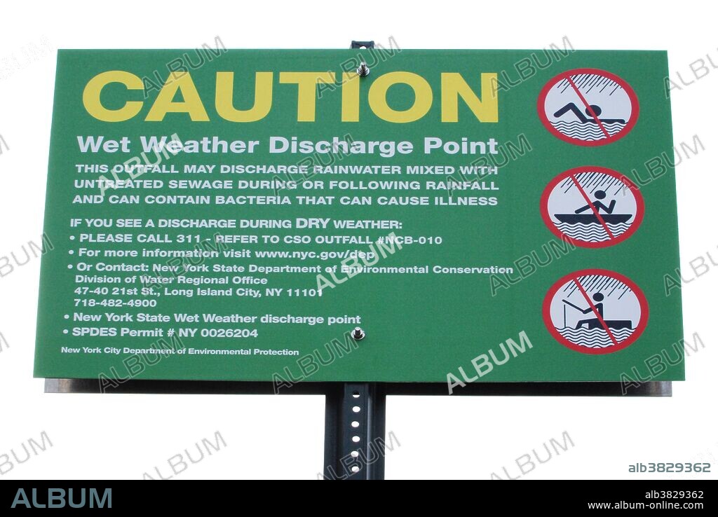 Sewage discharge point warning sign. Sign warns that raw sewage will be discharged here into the East River during heavy rainfall.