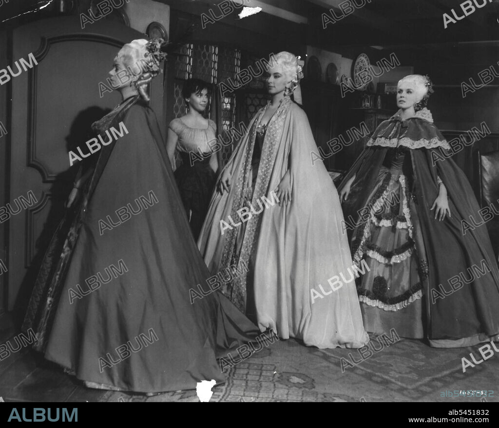 Off to the ball ... while Leslie Caron stands pop-eyed at their beauty, are, left to right, Elsa Lanchester, Amanda Blake and Lisa Daniels. M-G-M's "The Glass Slipper" was directed by Charles Walters and produced in color by Edwin H. Knopf. Michael Wilding co-stars and Keenan Wynn, Estelle Winwood, and Barry Jones also head the cast.Enviously she watches her stepmother and stepsisters (Elsa Lanchester, Amanda Blake and Lisa Daniels), leave for the palace ball. March 14, 1955.
