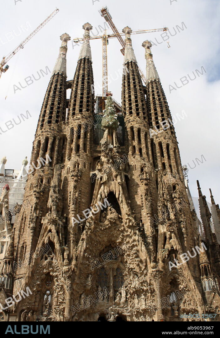 The Basilica I Temple Expiatori de la Sagrada Familia (Sagrada Familia). The very large Roman Catholic church was designed by Catalan architect Antoni Gaudi in a Spanish gothic style architecture as well as incorporating modernism, noucentisme and art nouveau. Although construction began in 1882 it was finally opened November 2010. Barcelona. Spain 2013.