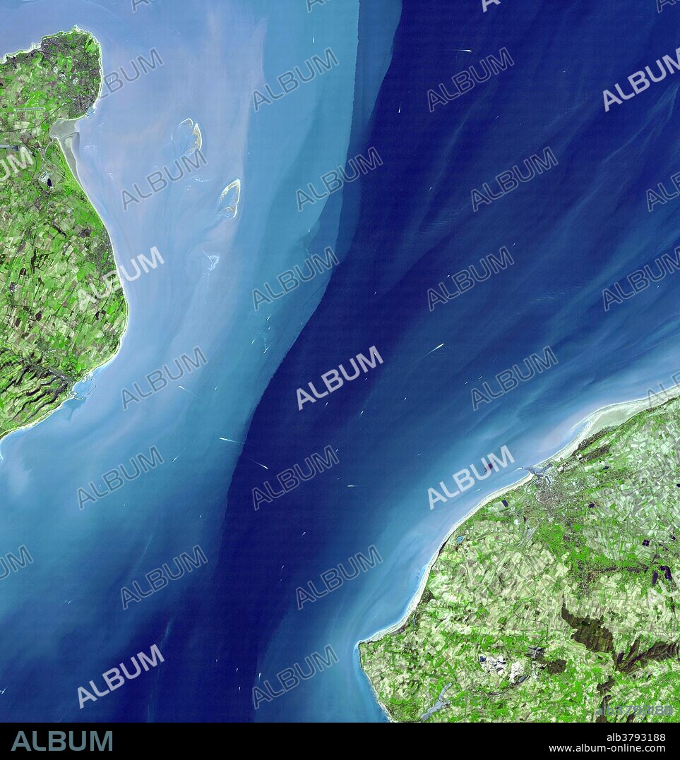 Strait of Dover, satellite image. Sea is blue, vegetation green. The Strait of Dover is the narrowest part of the English Channel, dividing Britain from France. At left is Dover, at the south-eastern point of England. The famous White Cliffs of Dover are just visible along the coastline. At right is Calais in northern France. The white flecks in the water are the wakes of boats and ferries. This image was taken by the Advanced Spaceborne Thermal Emission and Reflection Radiometer (ASTER) on NASA's Terra satellite on March 14th, 2001.