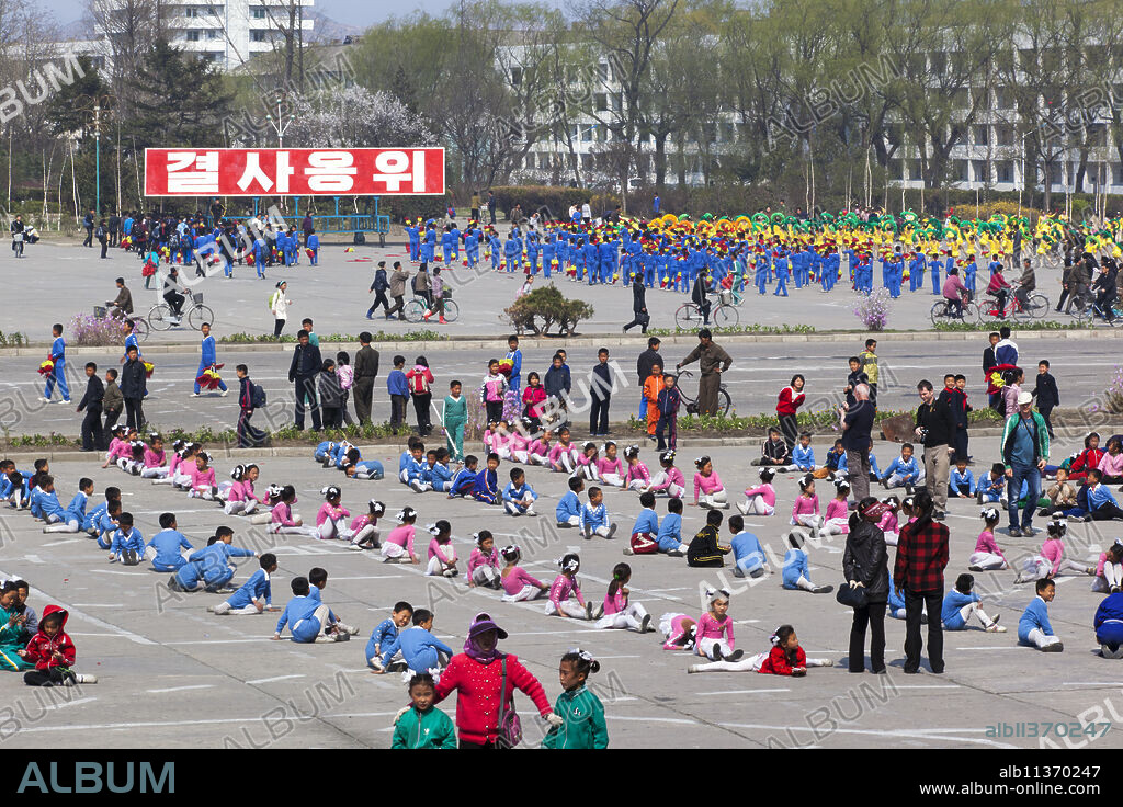 Children practising mass games outside the Grand Theatre, Hamhung, Democratic People's Republic of Korea (DPRK), North Korea, Asia.