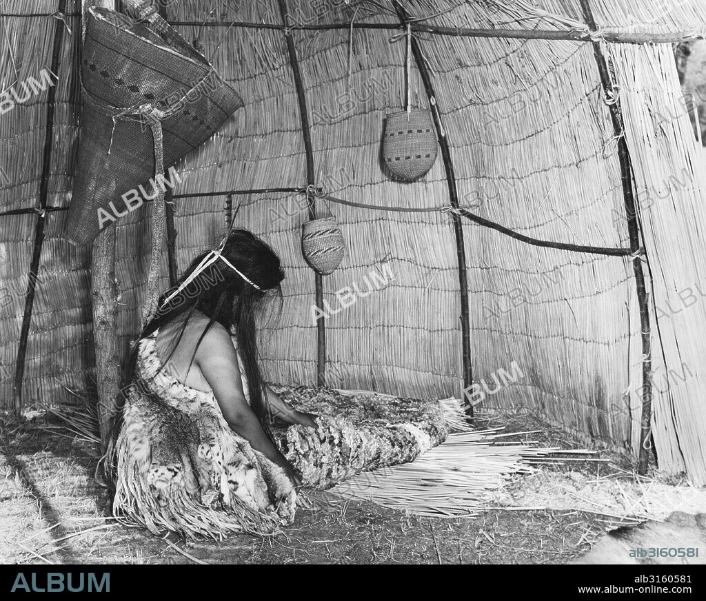 California: c. 1930 California Native American houses were used mainly for storage and sleeping. The Yokuts made a bed by digging a hole in the dirt floor and filling it with dried tules. The tule bed was covered with a skin blanket. Dried food, basket materials, string, beads and ornaments, and all kinds of supplies were stored in baskets hung from the framework of the house.