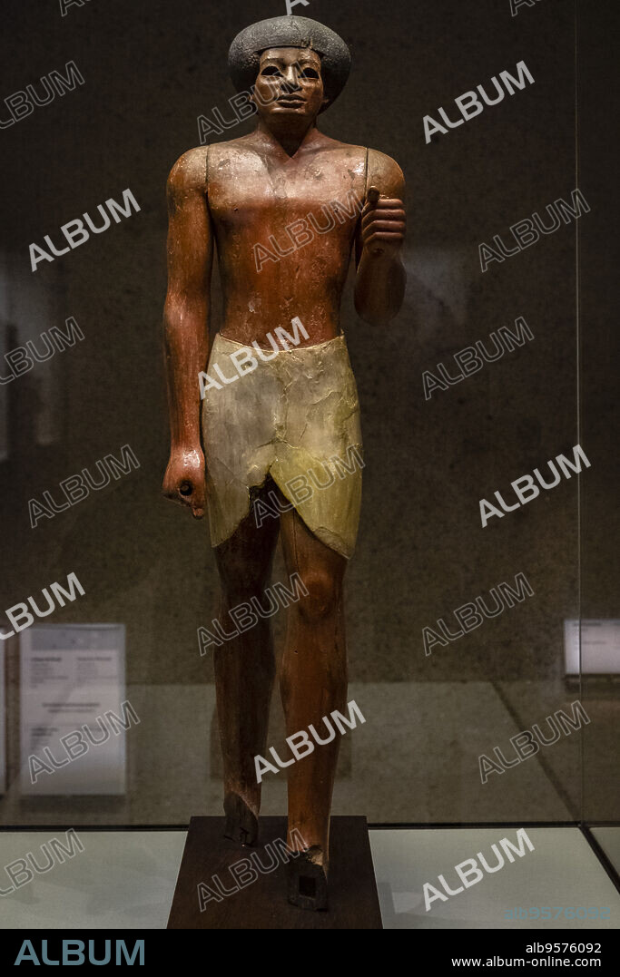 estatua funeraria, Imperio Medio de Egipto, XI dinastia, 2000 a. C., madera de ebano policromada, Fundación Calouste Gulbenkian, («Fundação Calouste Gulbenkian»), Lisboa, Portugal.