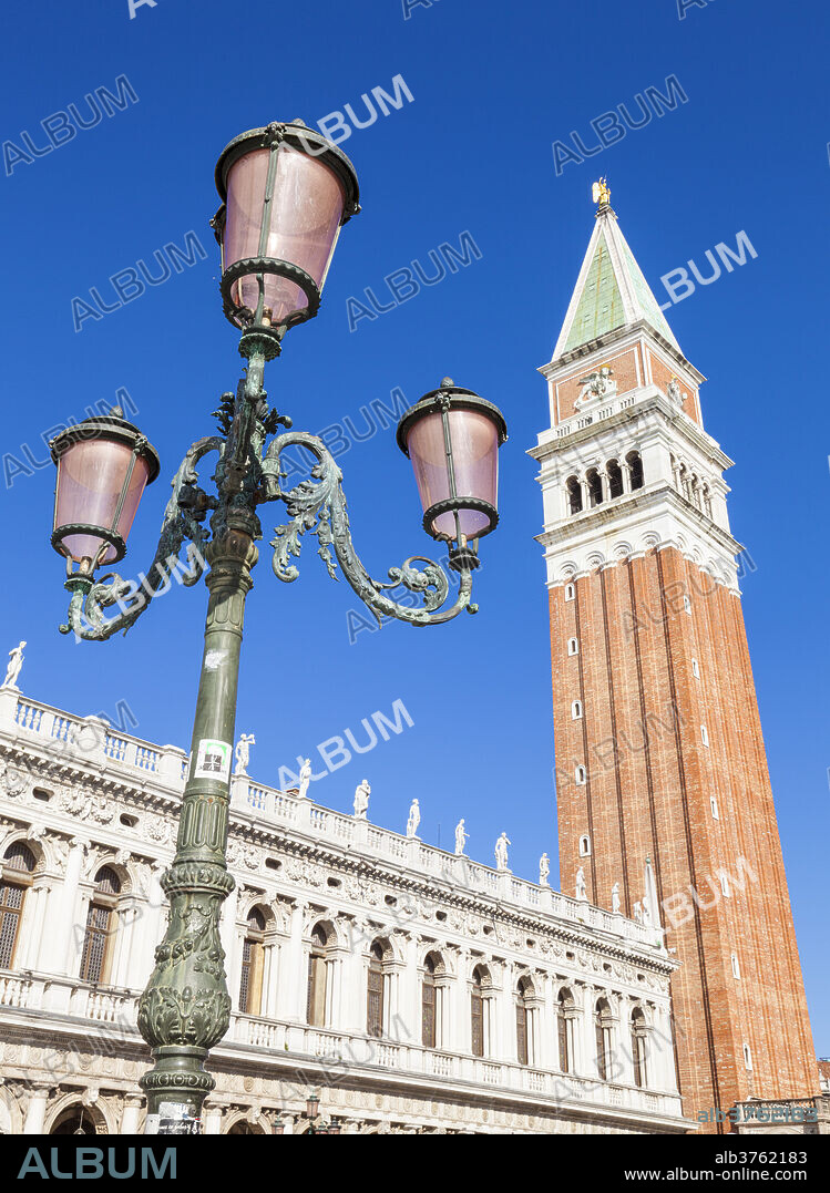 Campanile tower, traditional Venetian lamp post, Piazzetta, St. Marks Square, Venice, UNESCO World Heritage Site, Veneto, Italy, Europe.