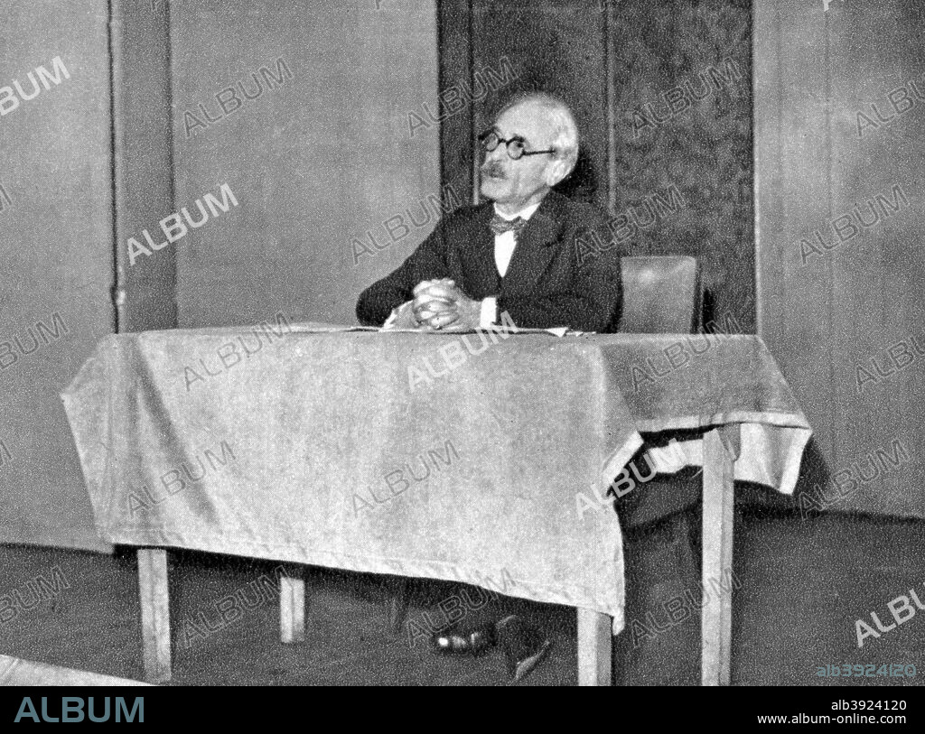 Paul Valery, French poet, essayist and philosopher, 1935. Valery (1871-1945) was a French author and Symbolist poet, he also wrote essays and aphorisms on art, history, letters, music, and current events. A photograph from Album de Photographies, Dans L'Intimite de Personnages Illustres, 1850-1950, Editions MD, 22 Rue de L'Arcade, Paris 8, 1850-1950.