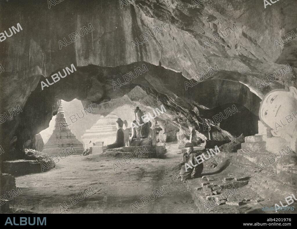 'The Caves at Moulmein', 1900. Underground temple of Kyat Khayon Cave Monastery. From "Typical Photographs of Burma - Burmese Life and Scenes". [Rowe & Co. Ltd., Rangoon, 1900].