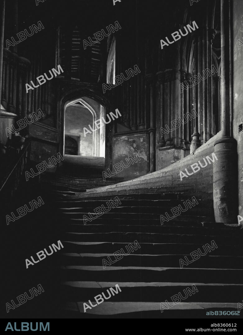 The Chapter steps in Wells Cathedral.Chapter Steps, Wells Cathedral, Somerset -- Inside Wells Cathedral is the beauty of simplicity, vistas of graceful pillars, pointed arches and vaulted roofs. There are endless treasures for the visitor to discover: the quaint carvings on the misericord seats, the exquistic curve of the stone steps leading to the Chapter House (pictured here), the cloisters and, of course, the famous fourteenth-century clock. January 1, 1953. (Photo by The British Travel & Holidays Association).