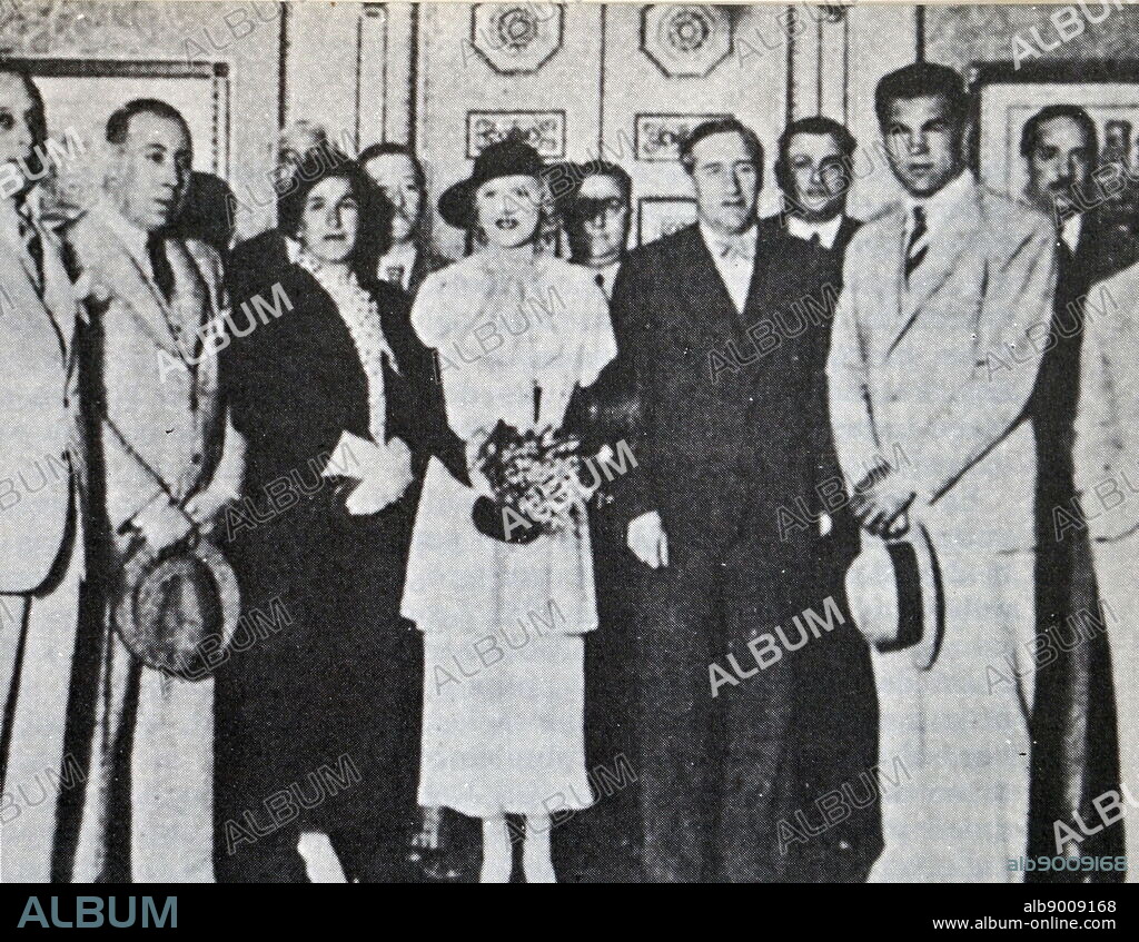 Members of the Straperlo scheme with famous athletes. Spain 1933. Two Dutch partners, Daniel Strauss, and Jules Perel with a third female partner, Lowann, the wife of Strauss. Straperlo was a scheme which tried to introduce in Spain in the 1930s a fraudulent roulette. The ensuing scandal was one of the several causes of the fall of the Republican government and the polarization of the parliament, which finally led to the Spanish Civil War (1936-1939).
