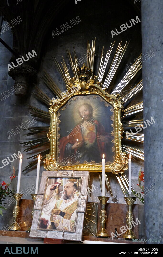 Photograph of an icon of Padre Pio, also known as Saint Pio, inside of St. Stephen's Cathedral, (Stephansdom), in Vienna which dates from the 12th to 15th centuries. Padre Pio (1887-1968) a friar, priest, stigmatist, and mystic, now venerated as a Saint of the Catholic Church. Dated 21st Century.