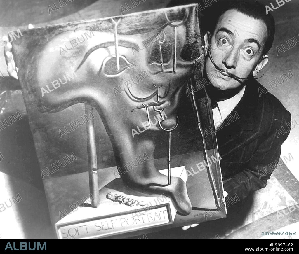 SALVADOR DALÍ. Salvador Dali with one of his works - A Soft Self Portrait. 1954.
