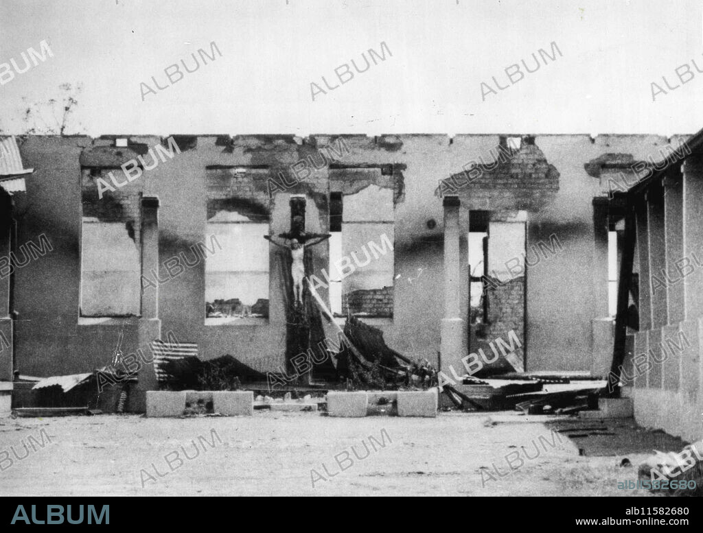 Church Set Ablaze By Africans In Riot Town OutbreakThe,ruined Roman Catholic church, St.  Peter Claver, East London, after it had been set on fire by Africans. The figure of Christ was undamaged although the cross was badly burnt.A native community hall and high school were also set ablaze in this trouble spot.Only a few days earlier East London had been the scene of anti,white rioting. November 16, 1952. (Photo by Planet News Ltd.).