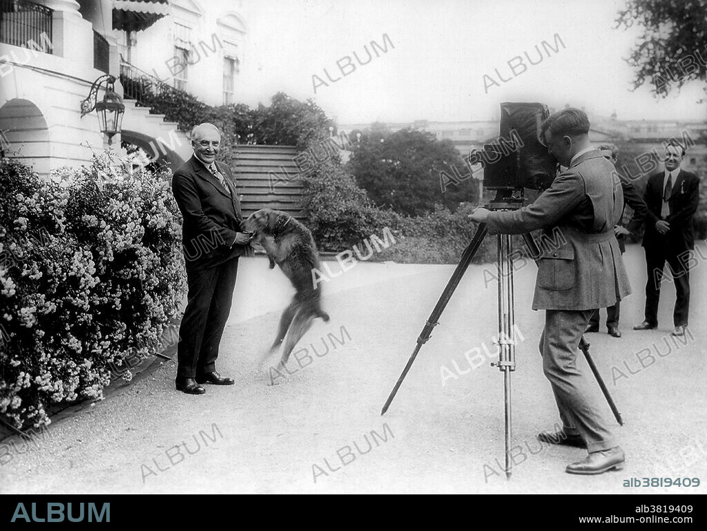 President Harding with pet dog Laddie Boy, being photographed in front of the White House. Warren Gamaliel Harding (November 2, 1865 - August 2, 1923) was the 29th President of the United States (1921-23). He defeated Democrat James M. Cox with the largest popular vote landslide (60% to 34%) in presidential history. He sought out the "best minds" in his cabinet, including Andrew Mellon at the Treasury, Herbert Hoover at Commerce, and Charles Evans Hughes at the State Department. He signed the first federal child welfare program, and dealt with striking mining and railroad workers in part by supporting an 8-hour work day. He created the Bureau of the Budget to prepare the first US federal budget. He advocated an anti-lynching bill to curb violence against African Americans, but it failed to pass Congress. In August 1923, Harding suddenly collapsed and died at the age of 57. In recent years there has been some recognition of his fiscal responsibility and endorsement of African-American civil rights. Harding has been viewed as a more modern politician who embraced technology and was sensitive to the plights of minorities, women, and labor. National Photo Company, June 13, 1922.