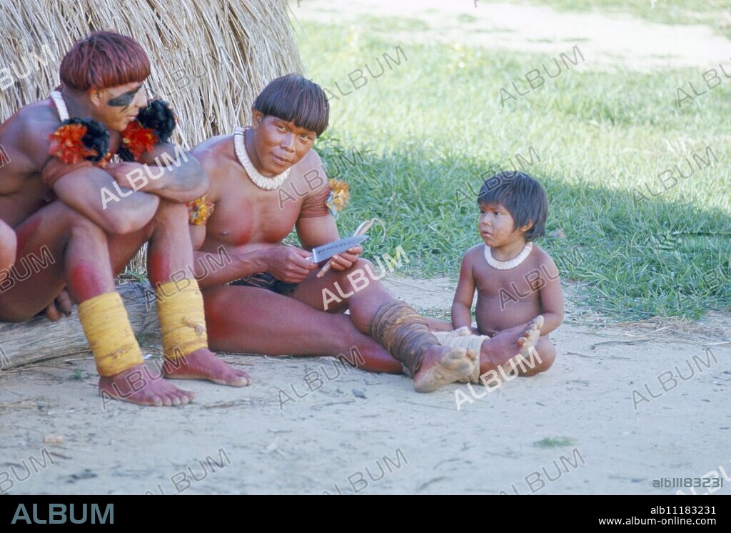 Kamayura Indian men and child, Xingu area, Brazil, South America.
