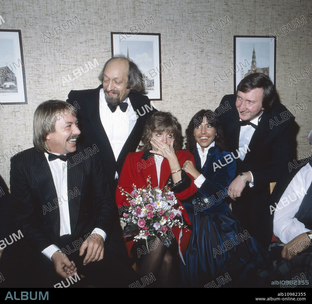German singer Werner Boehm with his newly wed wife Mary Roos and her sister Tina York and their friends Karl Dall and Mike Krueger (both standing behind), Germany 1981.