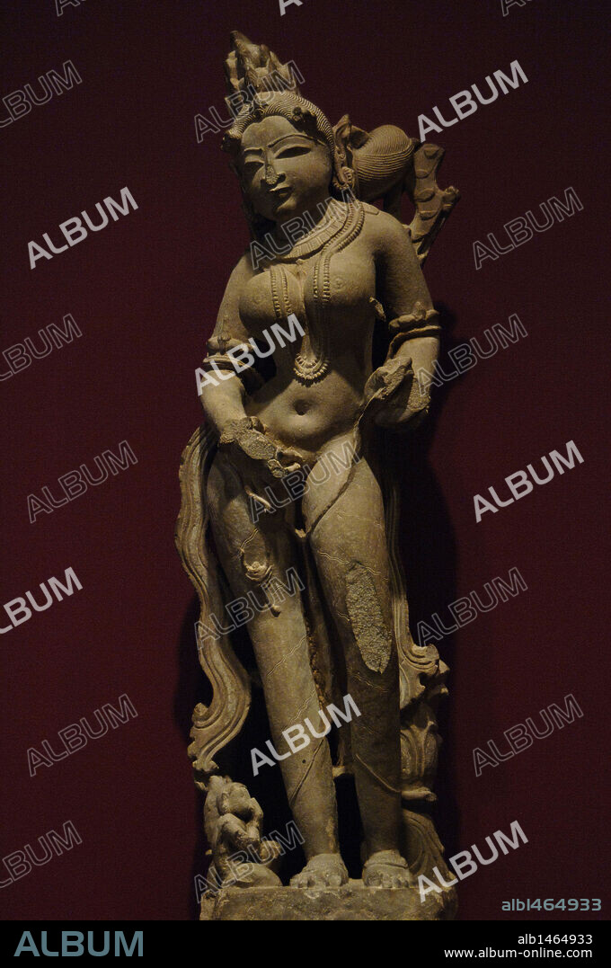 Celestial female (apsara) with scorpion on her leg. 11th century. From Khajuraho, India. Buff sandstone. Dallas Museum of Art. State of Texas. United States.