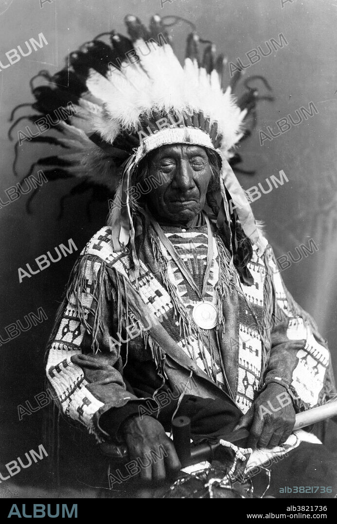 Chief Red Cloud, holding peace pipe, circa 1900s. Red Cloud (1822 - December 10, 1909) was a very strong war leader and a chief of the Oglala Lakota. The Oglala Lakota or Oglala Sioux are one of the seven sub-tribes of the Lakota people, who along with the Nakota and Dakota, make up the Great Sioux Nation. He led as a chief from 1868 to 1909. One of the most capable Native American opponents the United States Army faced, he led a successful campaign in 1866-1868 known as Red Cloud's War. After signing the Treaty of Fort Laramie (1868), he led his people in the important transition to reservation life, but continued fighting for his people. In 1887 he opposed the Dawes Act. The US declared additional communal tribal lands as excess, and sold it to emigrant settlers. In 1889 he opposed a treaty to sell more of the Lakota land. Due to his steadfastness and that of Sitting Bull, government agents obtained the necessary signatures for approval through subterfuge, such as using the signatures of children. He outlived all the other major Lakota leaders of the Indian Wars. He died in 1909 at the age of 87 on the Pine Ridge Reservation, where he was buried. He is quoted as saying in his old age, "They made us many promises, more than I can remember. But they kept but one. They promised to take our land...and they took it.".