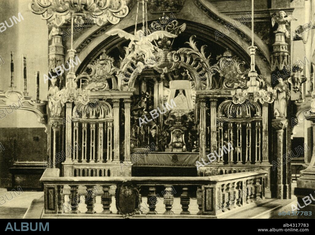 Altar of the Virgin Mary, Mariazell, Styria, Austria, c1935. Shrine containing a wooden image of the Virgin, in the Gnadenkapelle (built in 1690) of the Basilica Mariä Geburt (Basilica of the Birth of the Virgin Mary). The limewood statue, known as the Magna Mater Austriae (Great Mother of Austria), has been the focus of pilgrimages to the town of Mariazell for hundreds of years. From "Österreich - Land Und Volk", (Austria, Land and People). [R. Lechner (Wilhelm Müller), Vienna, c1935].