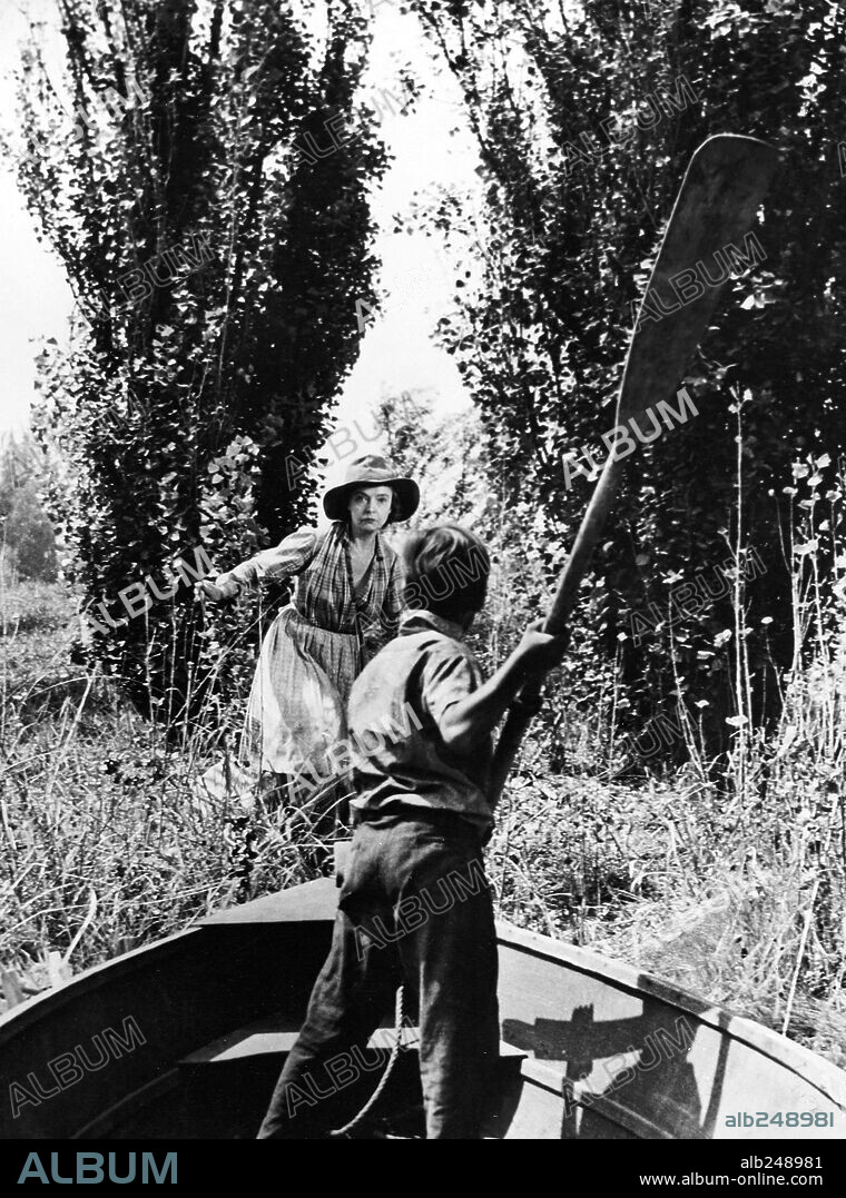 BILLY CHAPIN and LILLIAN GISH in THE NIGHT OF THE HUNTER, 1955, directed by CHARLES LAUGHTON. Copyright UNITED ARTISTS.