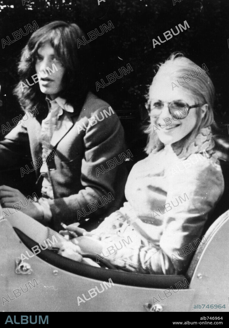 May 29, 1969; London, England, UK; Lead singer MICK JAGGER of the famous British rock group The Rolling Stones, the longest surviving group in the history of rock and roll with his girlfriend MARIANNE FAITHFULL, with whom Jagger and Richards composed several songs, pictured leaving the Royal Ballet. Mandatory Credit: Photo by KPA/ZUMA Press. (©) Copyright 1969 by KPA. 29/05/1969