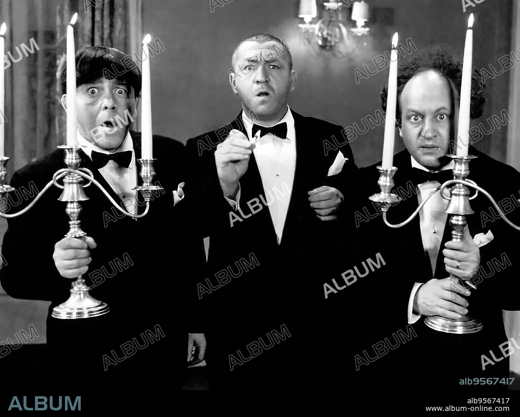 CURLY HOWARD, LARRY FINE, MOE HOWARD and THE THREE STOOGES in SPOOK LOUDER, 1943, directed by DEL LORD. Copyright COLUMBIA PICTURES.