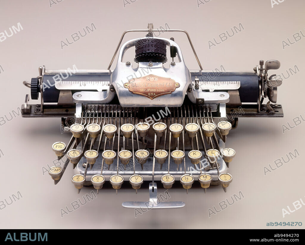 Blickensderfer 6' typewriter, c. 1906, George C. Blickensderfer; Manufacturer: Blickensderfer Manufacturing Company, American, 1850-1917, 5 x 12 x 8 1/2in. (12.7 x 30.5 x 21.6cm), Aluminum, other metals, United States, 19th century, The Blickensderfer model 6 was the the portable typewriter 2.0--an improvement over the Model 5 that had debuted at the Chicago World's Fair in 1893. The Model 6 was made of aluminum, rendering it lightweight, and like its predecessor, contained a fraction of the parts that made up its desktop contemporaries. Its rotating type wheel allowed for a speedy change in typefaces. Dubbed the 'Five-Pound Private Secretary,' the Model 6 was portable and durable; the company touted it in advertisements as being, 'in every way, a high class machine.' Like our own laptop computers and tablets today, it helped revolutionize work and communication while on the go.