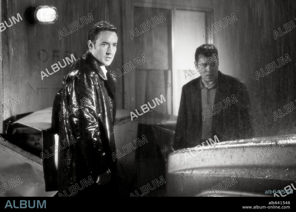 JOHN CUSACK and RAY LIOTTA in IDENTITY, 2003, directed by JAMES MANGOLD. Copyright COLUMBIA PICTURES / TENNER, SUZANNE.