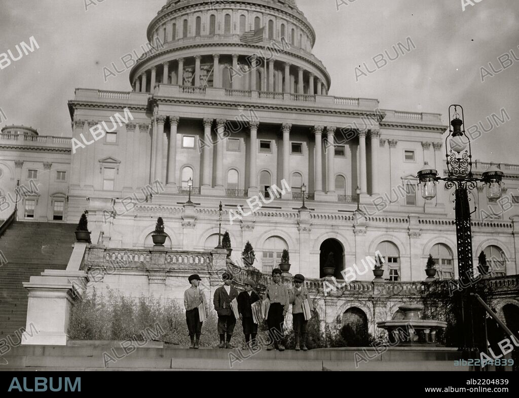 Group of Newsies selling on Capitol steps, April 11, 1912. Tony Passaro, (8 yrs. old). Dan Mercurio, (9 yrs. old). Joseph Tucci (10 years old). Peter Peper (10 yrs. old). John Carlino (11 yrs. old).