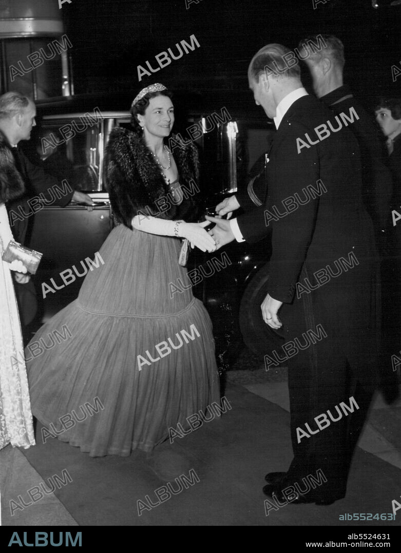 Queen Charlott's Birthday Ball -- The Duchess of Gloucester, wearing a crinoline gown of Shirred mushroom pink tulle, arrives at Grosvenor House for Queen Charlotte's Birthday Ball.The Duchess ceremoniously cut the top tier of the traditional 4ft. wide birthday cake (the rest was made of plastor) and admired the 109 red and blue (electric) candles, one for every year sine Queen Charlotte's death. May 13, 1953. (Photo by Evening Standard Picture).