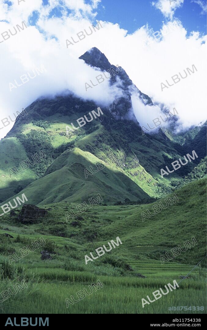 Mist floating over the deforested hills of Tram Ton Pass in Lao Cai province *** Local Caption ***.