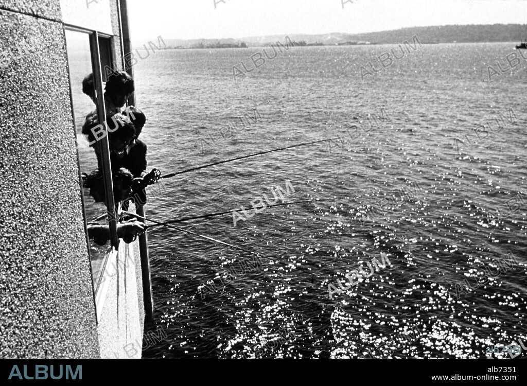 The Beatles fish from window of Seattle hotel, 1964.